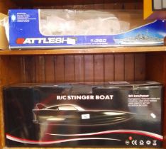 A radio controlled battleship and a remote controlled speedboat