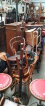 A pair of Fischel chairs and a bentwood chair, together with a beech standard lamp.