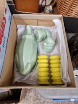 Carlton Ware comprising a pair of stylised yellow salt and pepper pots and a three piece