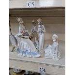 Six Spanish porcelain figures Damage to figure of girl holding kittens - kitten has one ear