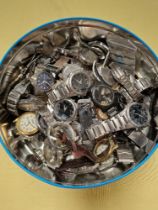 A bag of assorted watch parts.