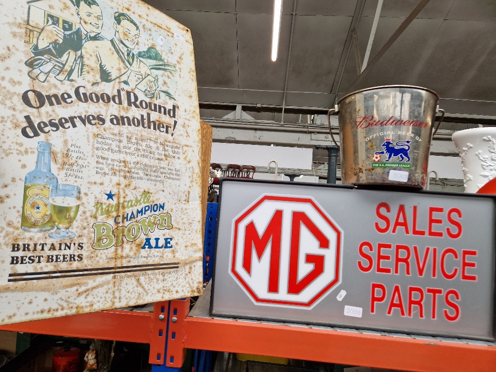 An MG 'Sales, Service, Parts' light up garage sign together with a FA Premier League champagne ice