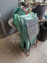 A metal garden table and four chairs.