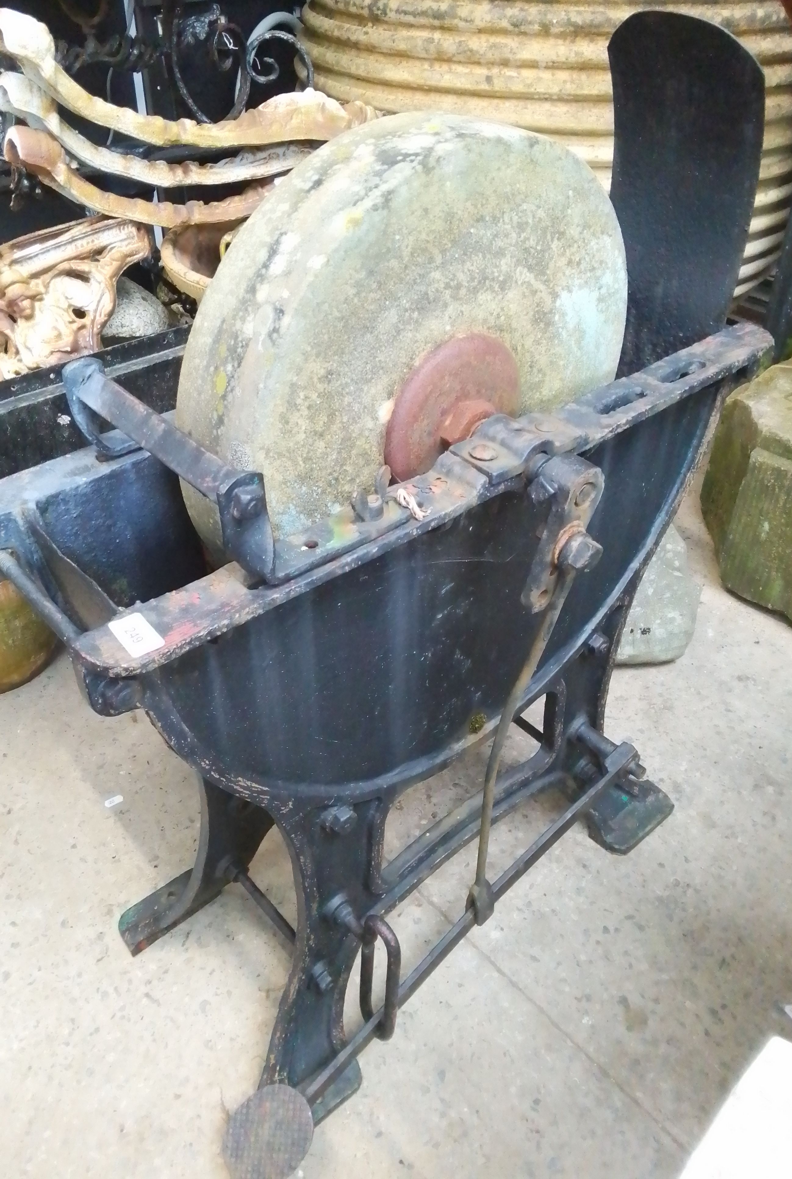 A stone grinding wheel, foot operated