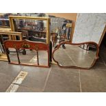 An Edwardian mahogany and hand painted mirror together with another mirror of a similar age.