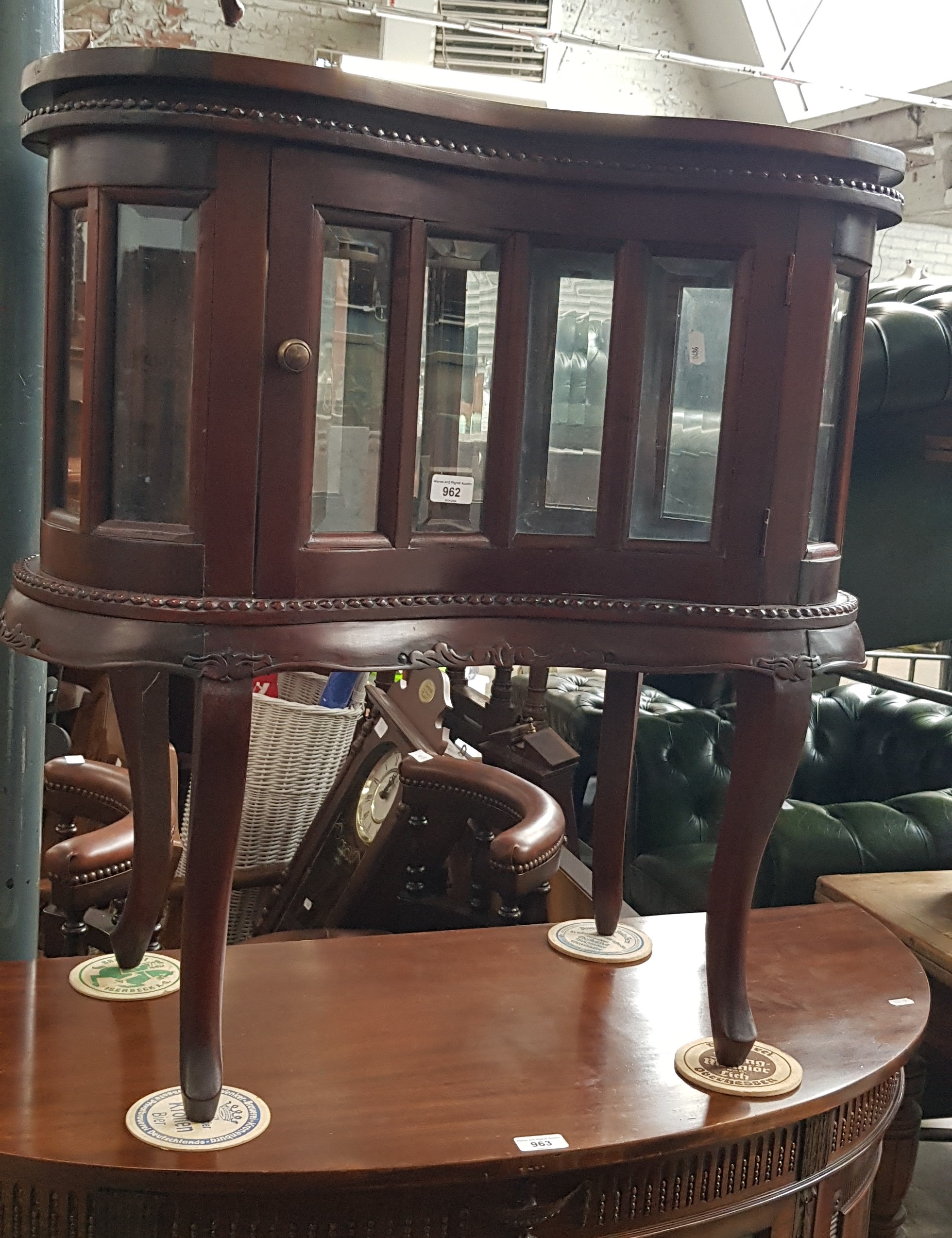 A mahogany drinks cabinet with tray top.