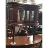 A mahogany drinks cabinet with tray top.