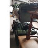 A green leather Chesterfield suite comprising three seater sofa, club chair, wingback armchair and