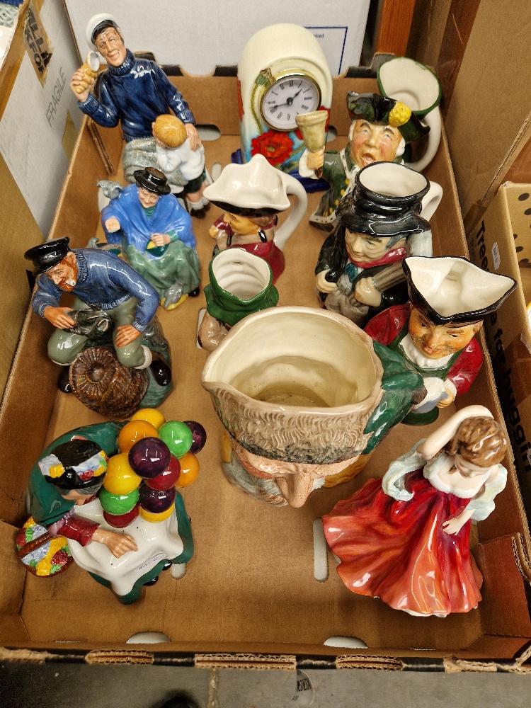 A box of assorted ornaments including four Royal Doulton figures, an Old Tupton ware clock, toby