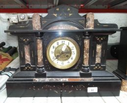 A slate and marble wall clock