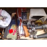 A box of collectables including binoculars, police truncheon, sun glasses, badges, police handcuffs,