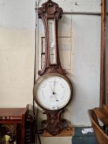 An early 20th century barometer/thermometer, the dial marked 'W Aronsberg Optician, Manchester &