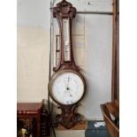 An early 20th century barometer/thermometer, the dial marked 'W Aronsberg Optician, Manchester &