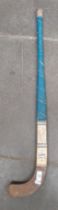 A 1956 Indian Olympic Hockey team hockey stick, signed by all the players, the stick made in India