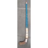 A 1956 Indian Olympic Hockey team hockey stick, signed by all the players, the stick made in India