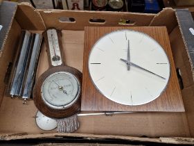 A Jungans Meister wall clock and a barometer.