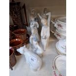 Eight Lladro figurines including girl with posy, polar bear, goose, girl with candlestick, seated