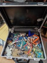 A case of assorted costume jewellery & watches