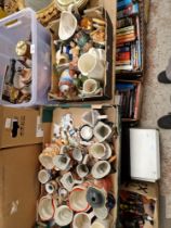 Two boxes of assorted pottery including Toby jugs and vintage TV.