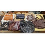 A mixed lot of leather handbags including Armani, DKNY, etc.