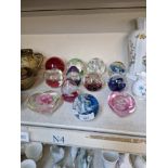 12 glass paperweights including Caithness