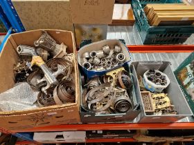 Three boxes of clock parts and tools.