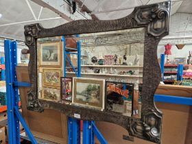 An early 20th century pewter framed wall mirror.