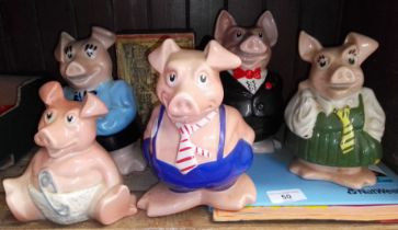 5 Nat West Pig money boxes together with a piggy bank statement holder and 2 editions of Piggy Press