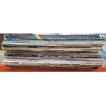 A box of vinyl LP records, mostly rock including Alice Cooper, Twisted Sister, Mott the Hoople,