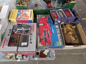 ASsorted toys including a Revell Ferrari F50, die-cast toys and two Harry Pottery books.