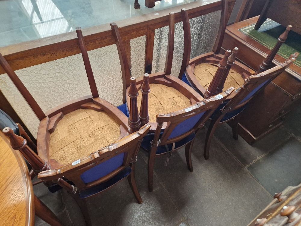 A set of six Victorian walnut dining chairs.