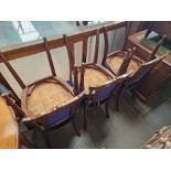 A set of six Victorian walnut dining chairs.