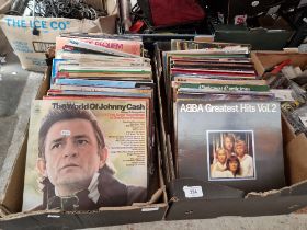 Two boxes of vinyl LP records, various artists and genres.