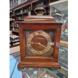 A reproduction mahogany bracket clock