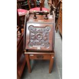 A Victorian coal scuttle and a piano stool.