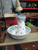 A Royal Doulton wash bowl and jug, with similar smaller jug