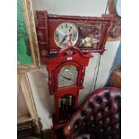 A reproduction granddaughter clock and a reproduction wall clock.