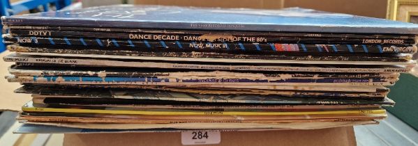 A box of vinyl LP records, rock and pop including Elton John, Roxy Music, The Police, etc.