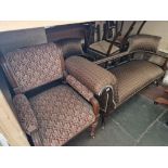 An Edwardian mahogany salon suite comprising chaise lung, two tub chairs and four occasional