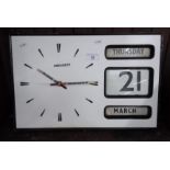 A Prescott wall calendar clock