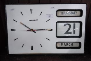 A Prescott wall calendar clock