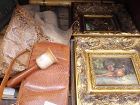 A mixed lot comprising two prints, a leather handbag, a snake skin, a treen tape measure, knitting