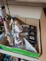 A group of collectables to include a Lladro plaque, Lladro boy figurine, Nao lamp, BEDE plate....