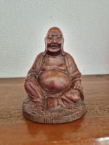 Small carved wooden Budha