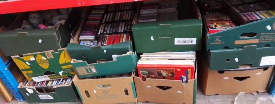 11 boxes containing pictures (2 boxes), pottery, music cassettes (3 boxes), CDs (2 boxes), Lps (3