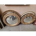 Four vintage convex mirrors.