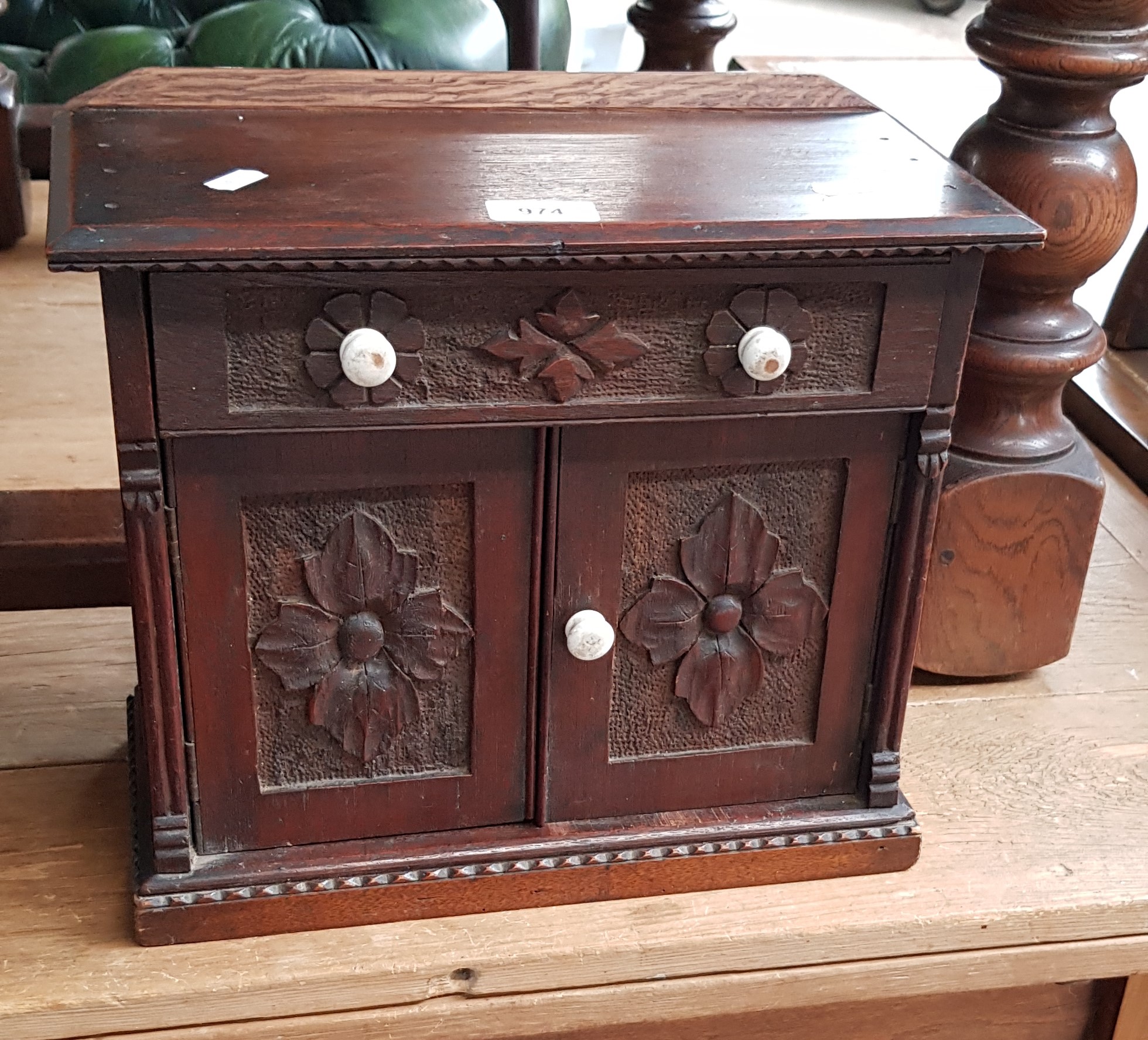 A Victorian carved oak miniature chiffonier/sideboard with ceramic handles.