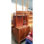 A walnut drinks cabinet together with a pair of demi-lune side tables.