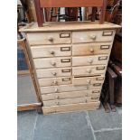 A Victorian pine apothecary/filing chest of drawers.