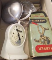 A mixed lot of vintage kitchenalia comprising scales, food mincer and an egg beater.